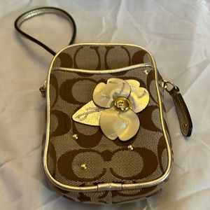 Coach cell phone wristlet.